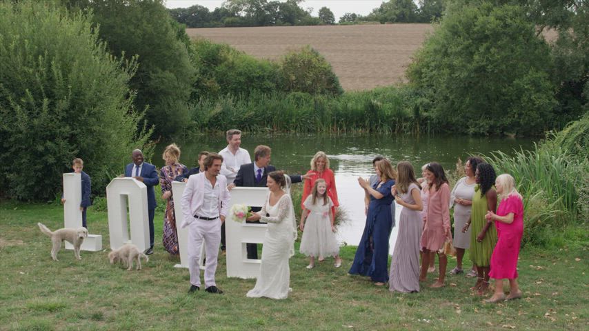 ws-bride-throwing-bouquet-in-front-of-giant-letters-spelling-love-dinton-wiltshire-united-kingdom
